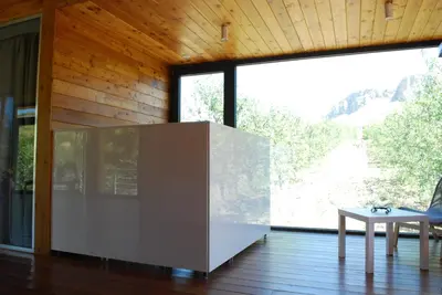 a room with a table and a large window at Il Bevaio Di Corleone in Corleone