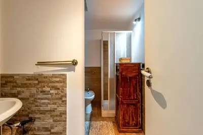 a bathroom with a toilet and a sink at Casa Goethe delle Volte by Wonderful Italy in Palermo