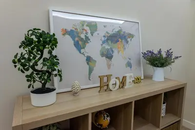 a tv sitting on a shelf with a world map at Daria's home apartment rooms in Palermo