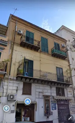 a building with balconies on the side of it at Alloggio Garibaldi in Palermo