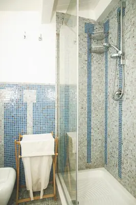 a bathroom with a shower and a toilet and a sink at Villa sulla spiaggia Riva Estate by Le Dhome Sicily in Trappeto