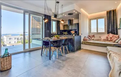 a kitchen and living room with a table and a couch at Beautiful Apartment In Trappeto in Trappeto