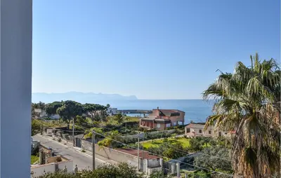 a view of the ocean from a building at Beautiful Apartment In Trappeto in Trappeto