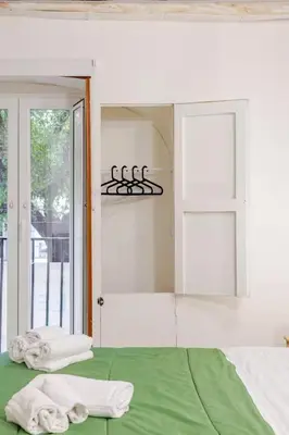 a bedroom with a bed with towels on it at Talia Capo Massimo in Palermo