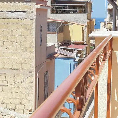 a balcony of a building with a swimming pool at Sunshine Apartments in Trappeto