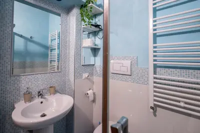 a bathroom with a sink and a mirror at Plumeria Vacanze in centro a Palermo- Isidoro Carini zona Politeama in Palermo