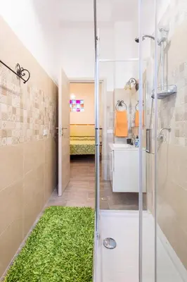 a bathroom with a shower and a sink and a shower at Casa Lo Re in Bagheria