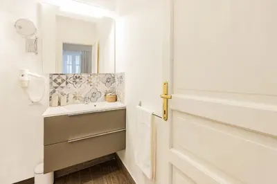 a bathroom with a sink and a mirror at Kepos Rooms and Suites in Palermo