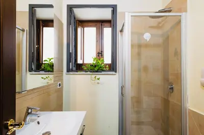 a bathroom with a sink and a shower at I Carrettieri - a few steps from the Cathedral in Palermo