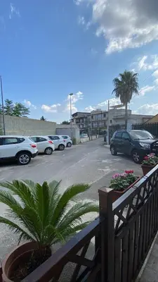 a parking lot with a bunch of parked cars at Casetta Matotta, casa vacanze a Mondello - Palermo in Mondello