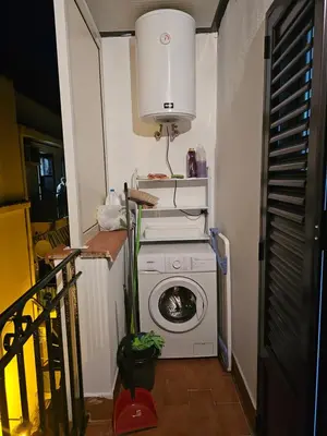a washer and dryer in a small room at VeraHouse in Palermo