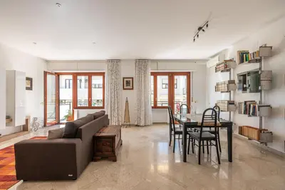 a living room with a couch and a table at La Cassatella family home in Palermo