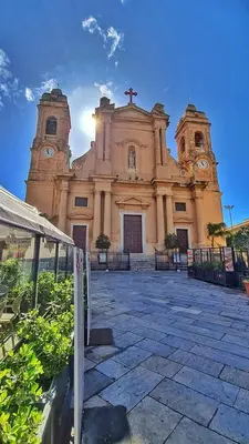 an old church with a cross on top of it at NONNO PEPPE Suites 1, 2 & 3 in Terrasini