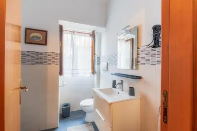 a bathroom with a sink and a toilet at Casa Marina in Palermo