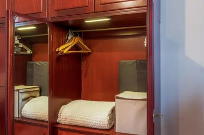 a glass cabinet with a bed inside of it at Casa Marina in Palermo
