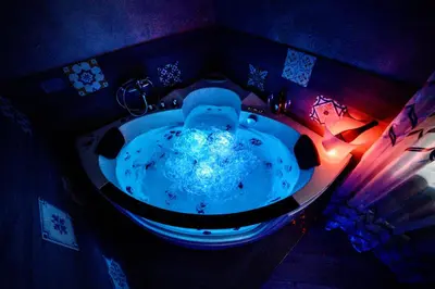 a bathroom with a large tub in a room at Le terrazze di Giulia in Palermo