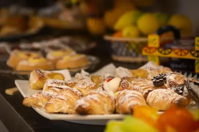 a bunch of pastries on a plate on a table at C'era Una Volta in Palermo