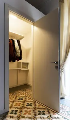 an open door in a room with a closet at C'era Una Volta in Palermo