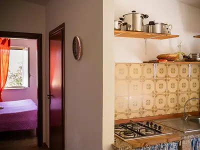 a kitchen with a stove top oven in a room at Apartment Sole by Interhome in Trappeto