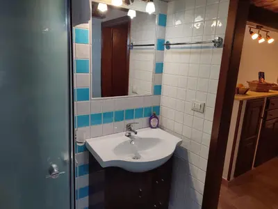 a bathroom with a sink and a mirror at BONELLUS in Palermo