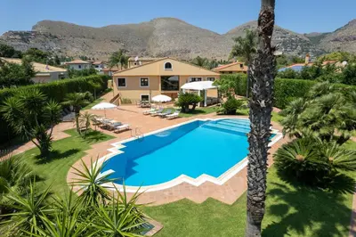 an overhead view of a swimming pool in front of a house at Villa lady olimpia in Palermo