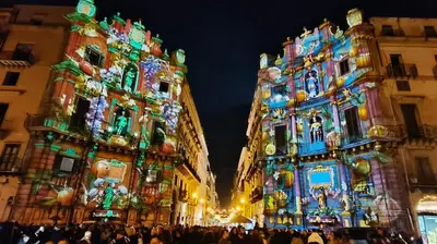 a group of buildings with christmas lights on them at Porta dei Mori Apartment in Palermo