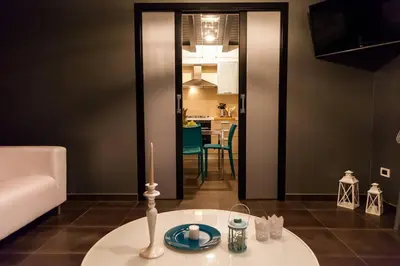 a living room with a candle on a table at Villa Salvo in Balestrate
