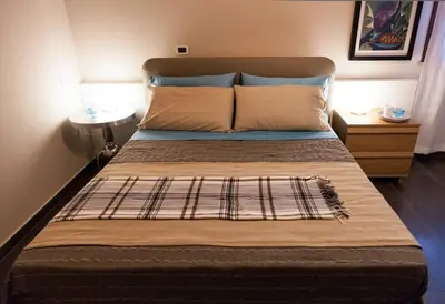 a large bed in a room with a bed sidx sidx sidx at Villa Salvo in Balestrate