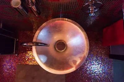a metal bowl on a wall with colored lights at Villa Salvo in Balestrate