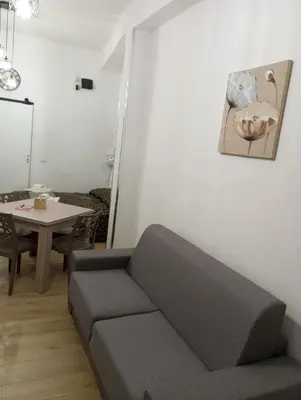 a living room with a couch and a table at Casa Chiaretta in Palermo