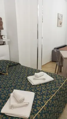 a hotel room with two towels on a bed at Casa Chiaretta in Palermo