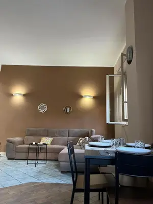 a living room with a couch and a table at Palermo Houses in Palermo