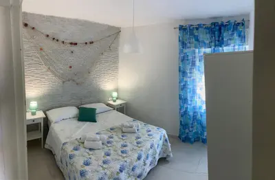 a bedroom with a bed with two towels on it at Addauro in Alcamo