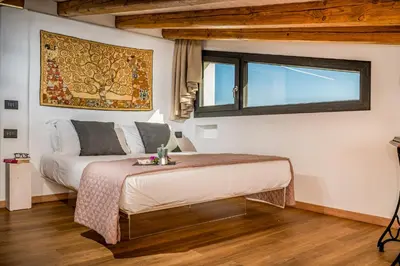 a bedroom with a bed and a window at Villa Pharus Scopello in Scopello