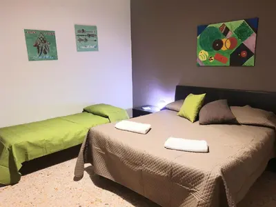 two beds sitting next to each other in a room at Dolce casa centro storico di Palermo new 2023 in Palermo