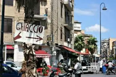a sign for a chicagooco restaurant on a city street at Dolce casa centro storico di Palermo new 2023 in Palermo
