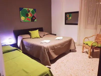 a bedroom with a bed with two towels on it at Dolce casa centro storico di Palermo new 2023 in Palermo
