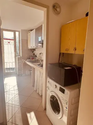 a kitchen with a washer and dryer in it at Casa nonno Enrico in via Oreto in Palermo