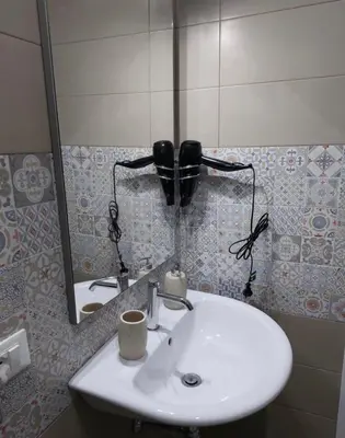 a bathroom with a white sink and a mirror at La Cupola - casa vacanze n 8 in Termini Imerese