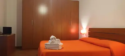 a bedroom with a bed with towels on it at Casa Vacanza Edy in Palermo