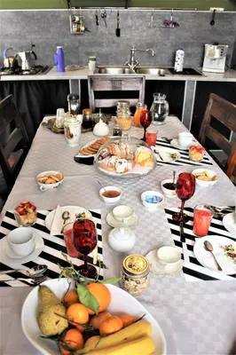 a long table with plates of food on it at La Via delle Biciclette in Palermo