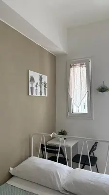 a white table and two chairs in a room at Notarbartolo Room#200 in Palermo