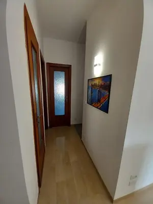 a hallway with a door and a picture on the wall at Domus Oreto in Palermo
