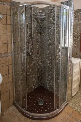 a shower with a glass enclosure in a bathroom at Nelly Casa Vacanze in Porticello