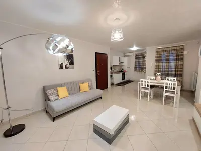 a living room with a couch and a table at Vespucci Holiday in Casteldaccia