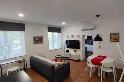 a living room with a couch and a table at GIO&GIO central house in Palermo