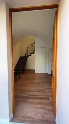 a hallway with a staircase in a house at GIO&GIO central house in Palermo