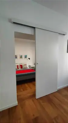 a white room with a bed in a room at GIO&GIO central house in Palermo
