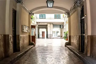 an empty hallway in an old building with a ceiling at B&B da Nonna Cicci APT vicino al Teatro Massimo in Palermo