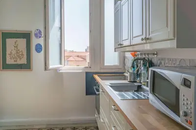 a kitchen with a sink and a microwave at B&B da Nonna Cicci APT vicino al Teatro Massimo in Palermo